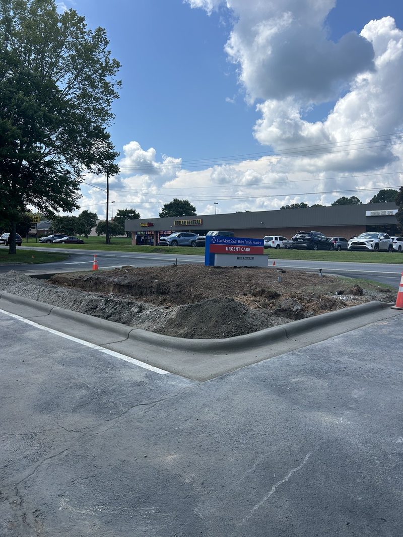 Smooth concrete curb and gutter in Gastonia NC commercial parking lot