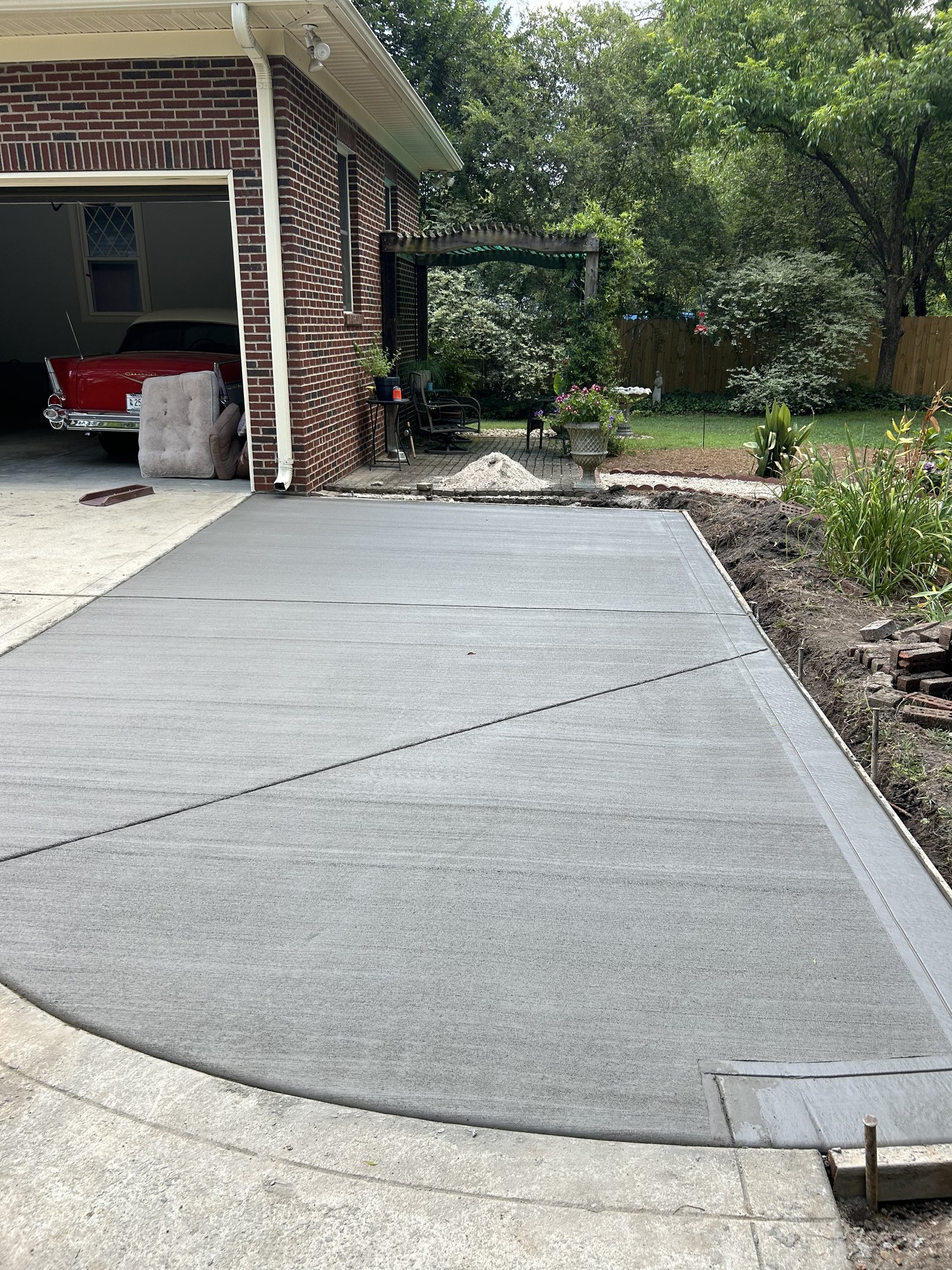 Broom finish concrete driveway by Santiz Concrete Finishing