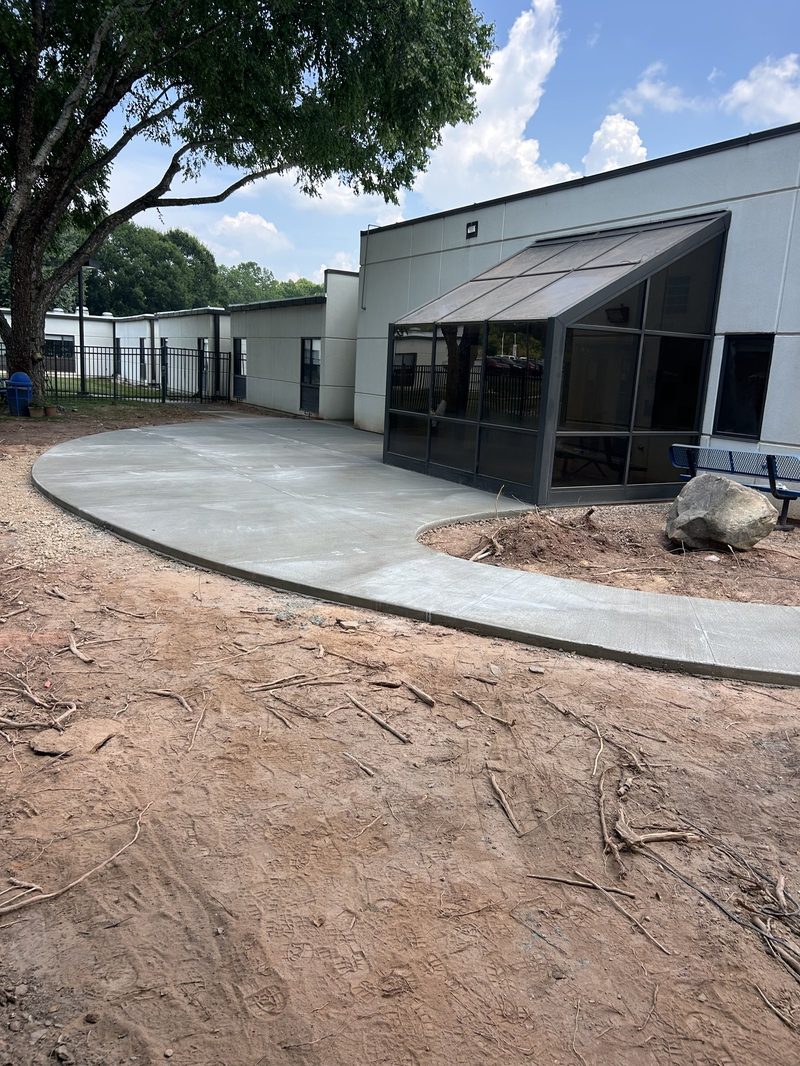 Broom finish concrete sidewalk leading to commercial building in Spartanburg SC