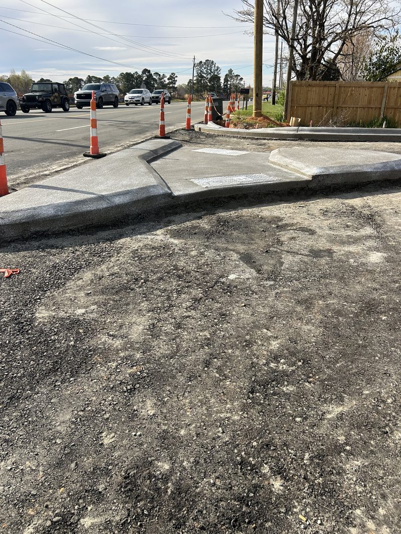 New concrete curb and gutter alongside street in Gastonia NC