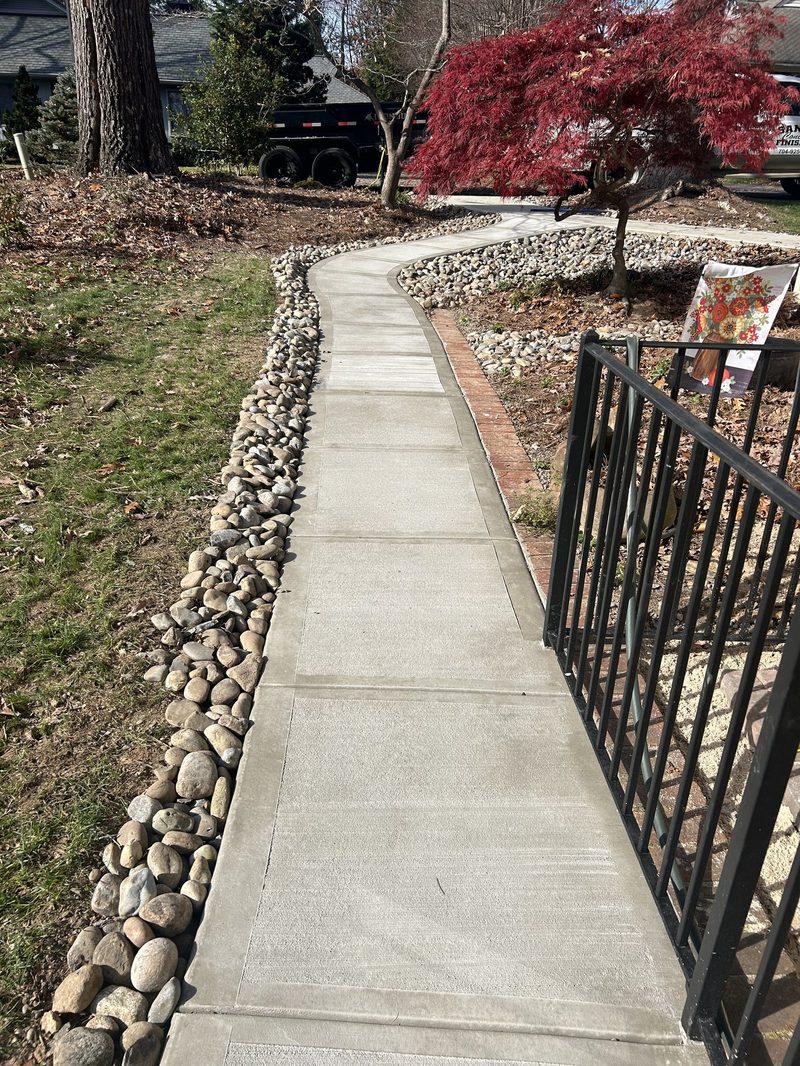 Newly installed concrete sidewalk in Spartanburg SC with broom finish