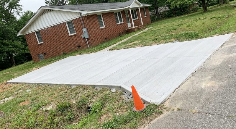 New broom finish concrete driveway at brick home in Gaffney SC